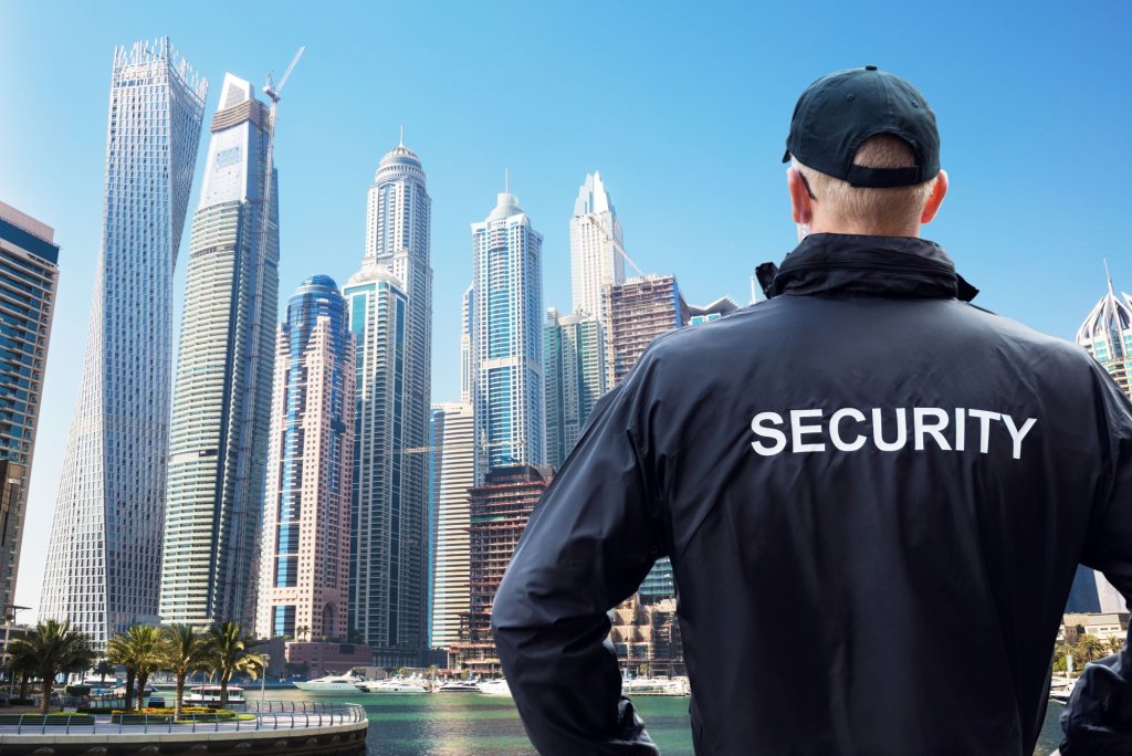 A security man looking to the skyline of Dubai.