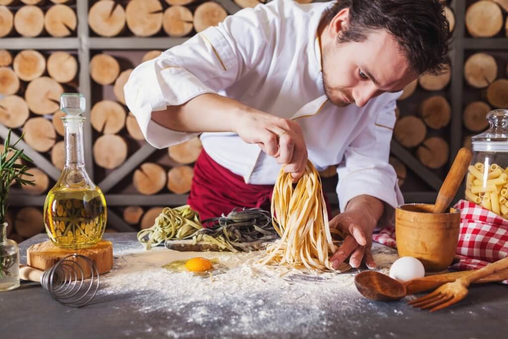 Chef preparing fresh pasta.