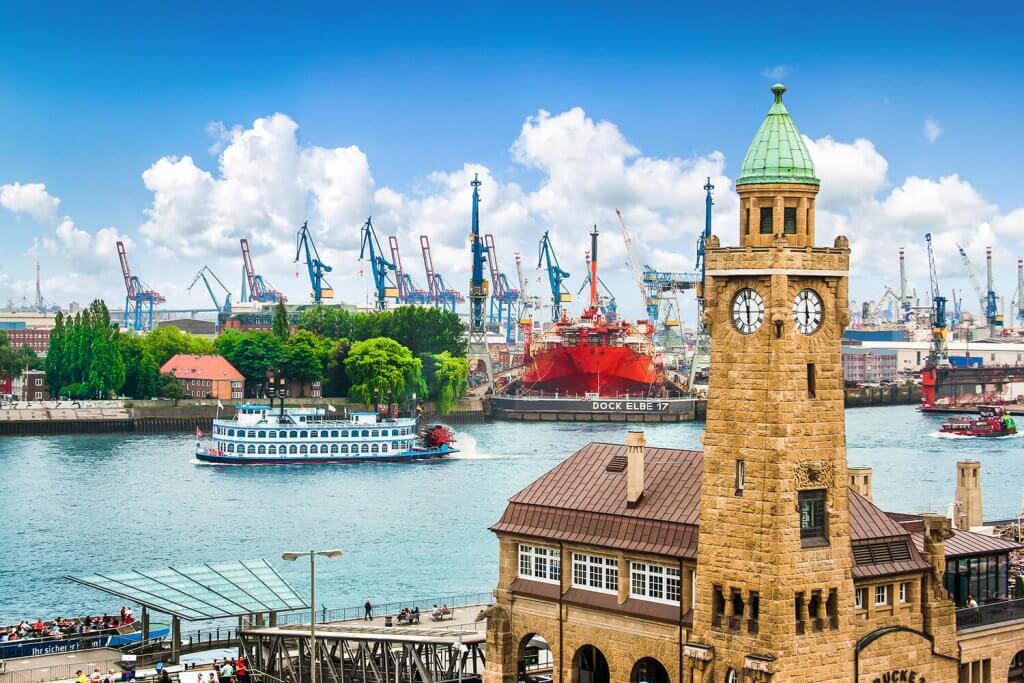 View of the port of hamburg with cranes and ships in the background