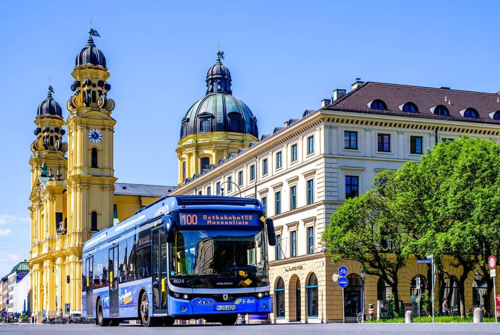 Blue Bus driving in the city center of Munich.