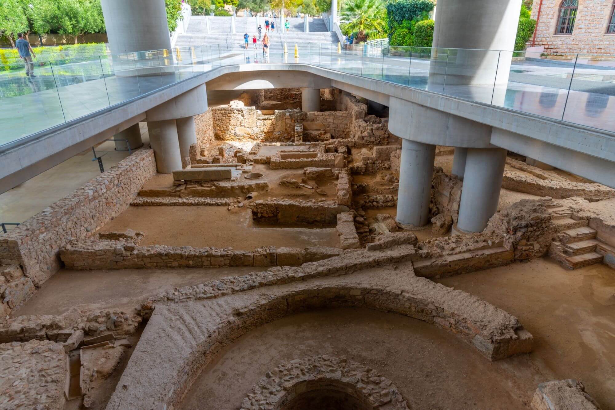 View from the transparent platform of the New Acropolis Museum down to the archaeological site.