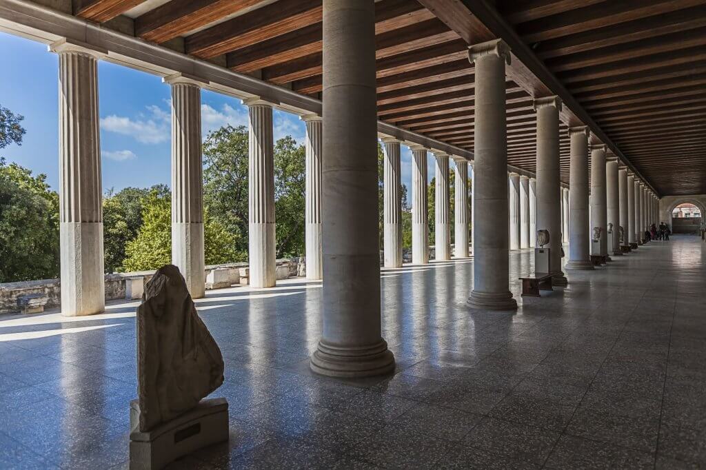 View of a corridor with many columns in the Stoa of Attalos in Athens.