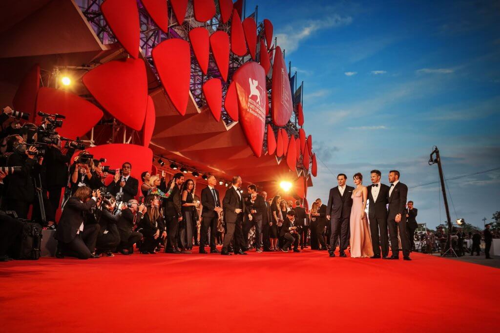 Johnny Depp, Dakota Johnson, director Scott Cooper and Joel Edgerton attend a premiere for 'Black Mass' during the 72nd Venice Film Festival