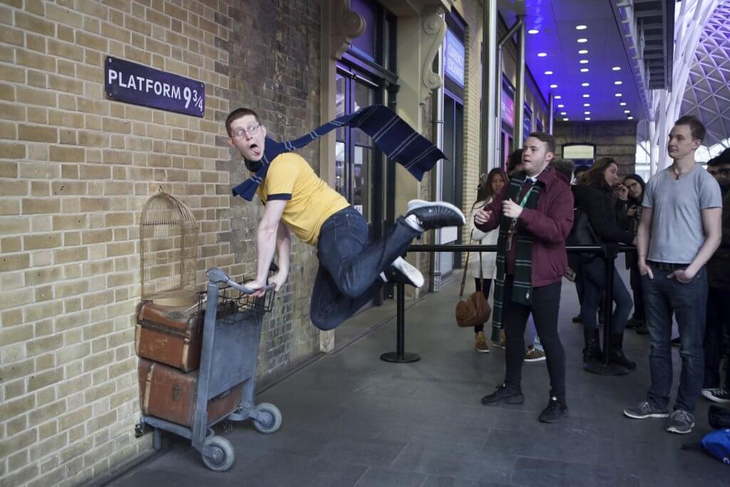 Fans of Harry Potter have visited the wall of Kings Cross station to photograph the sign for platform nine and three quarters with the carriage