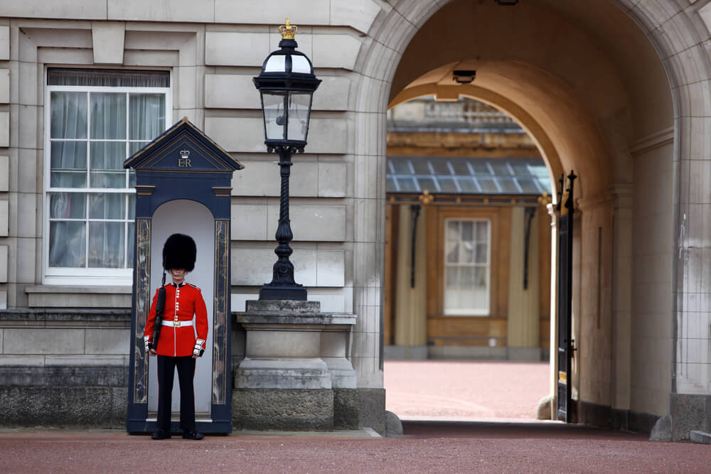 A guard of the Grenadier Guards posted in front of Buckingham Palace in London.